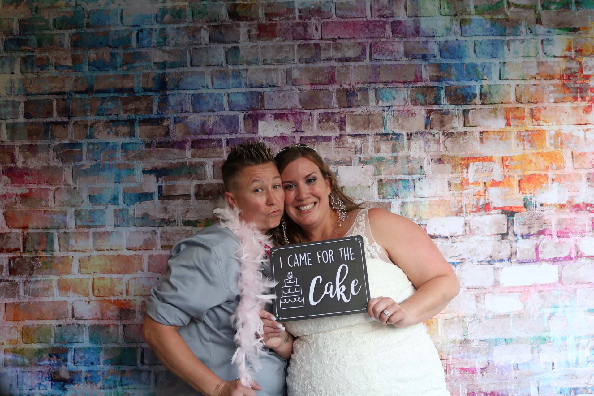 utah wedding photo booth with a colorful brick wall